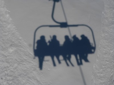 Happy skiers on the chair lift!